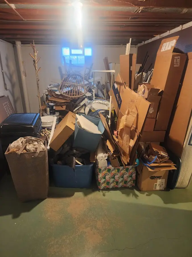 Roll-off dumpster container at job site for 2 Yard Dumpster Rental in Bettendorf